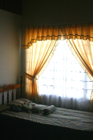 The third bedroom has a large custom window.