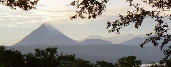 Dawn brings a beautiful of of Arenal Volcano at the other end of the long twisting lake 20 miles away.