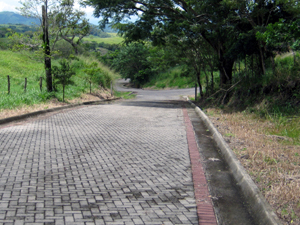 There are three intersections in the paved roads within Hacienda Real.